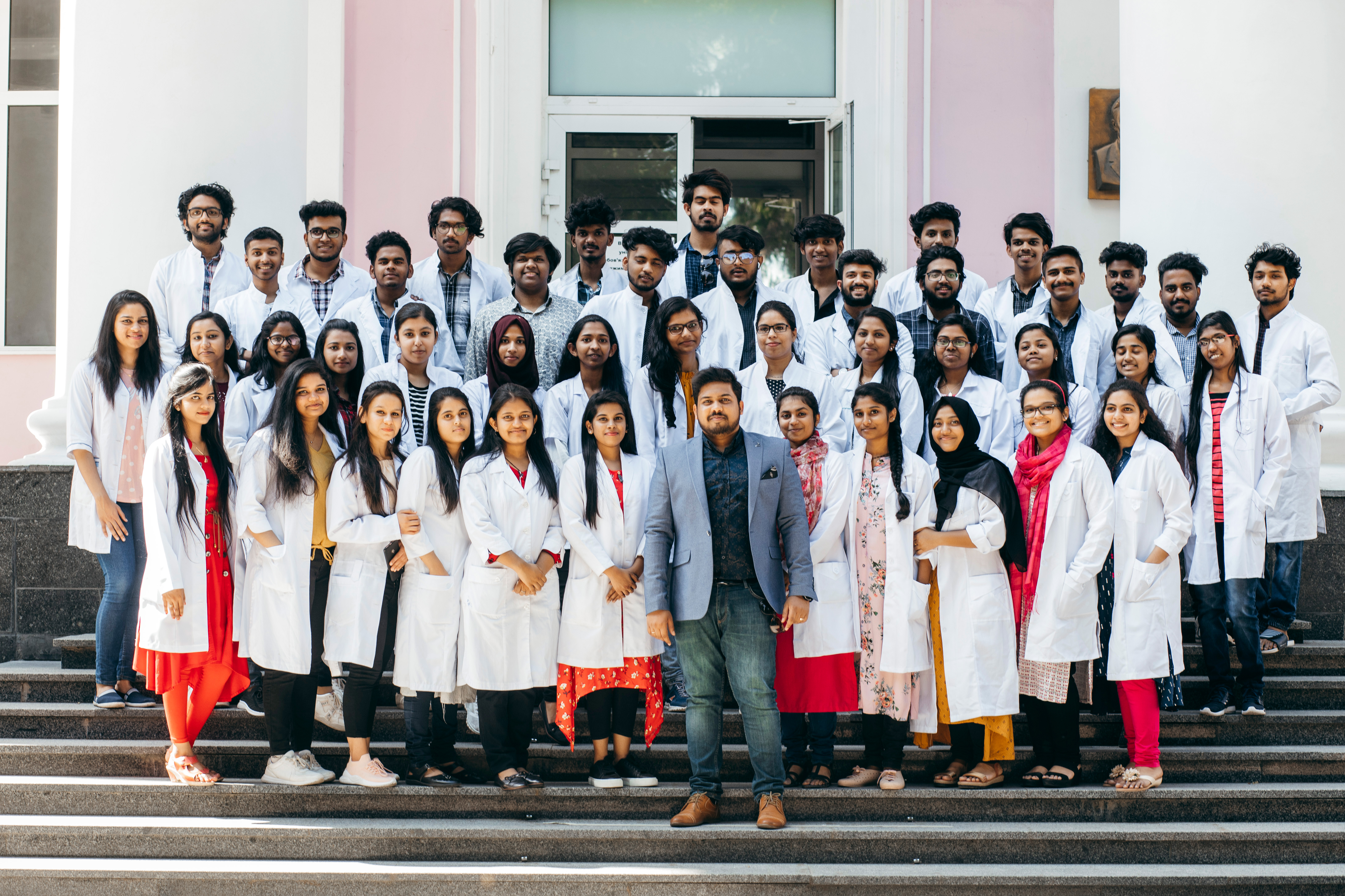 Patrick's Edu Care students with Dr. Patrick at their university abroad