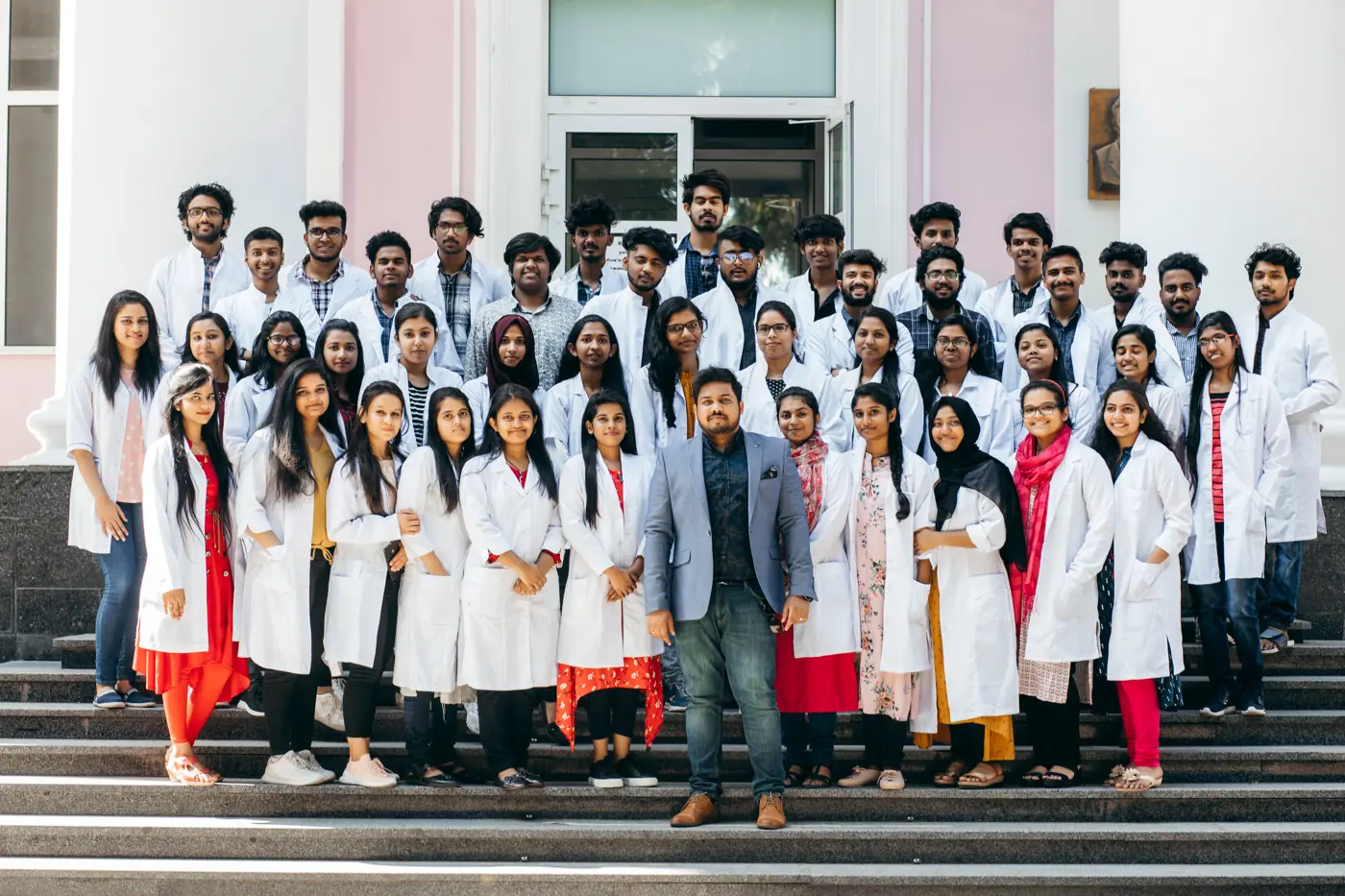 Patrick's Edu Care students with Dr. Patrick at their university abroad